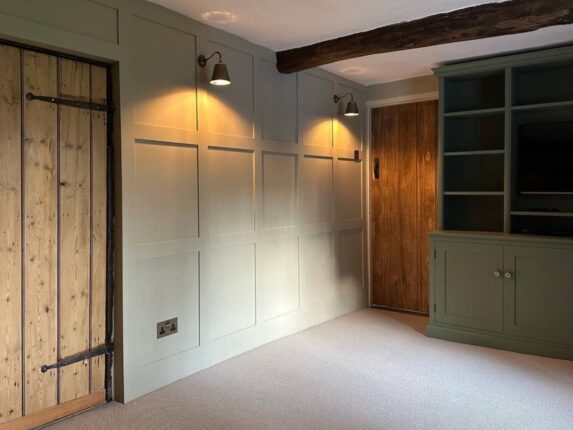 Sage green shaker cabinet and panelling